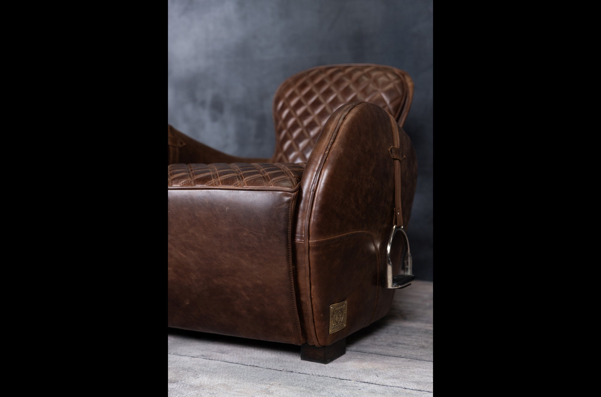 EQUESTRIAN LEATHER CHAIR AND OTTOMAN