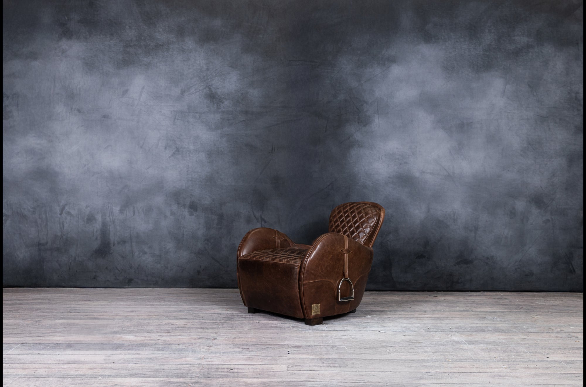 EQUESTRIAN LEATHER CHAIR AND OTTOMAN