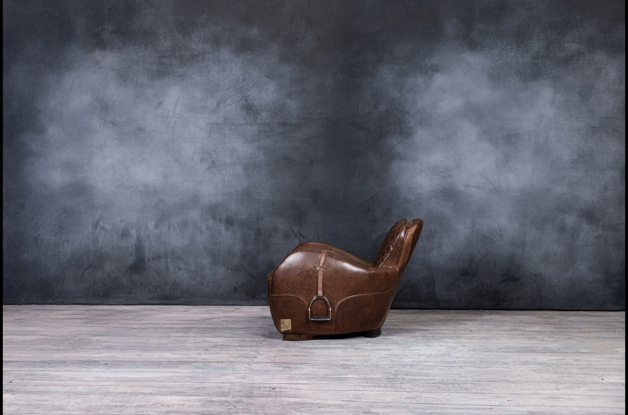 EQUESTRIAN LEATHER CHAIR AND OTTOMAN