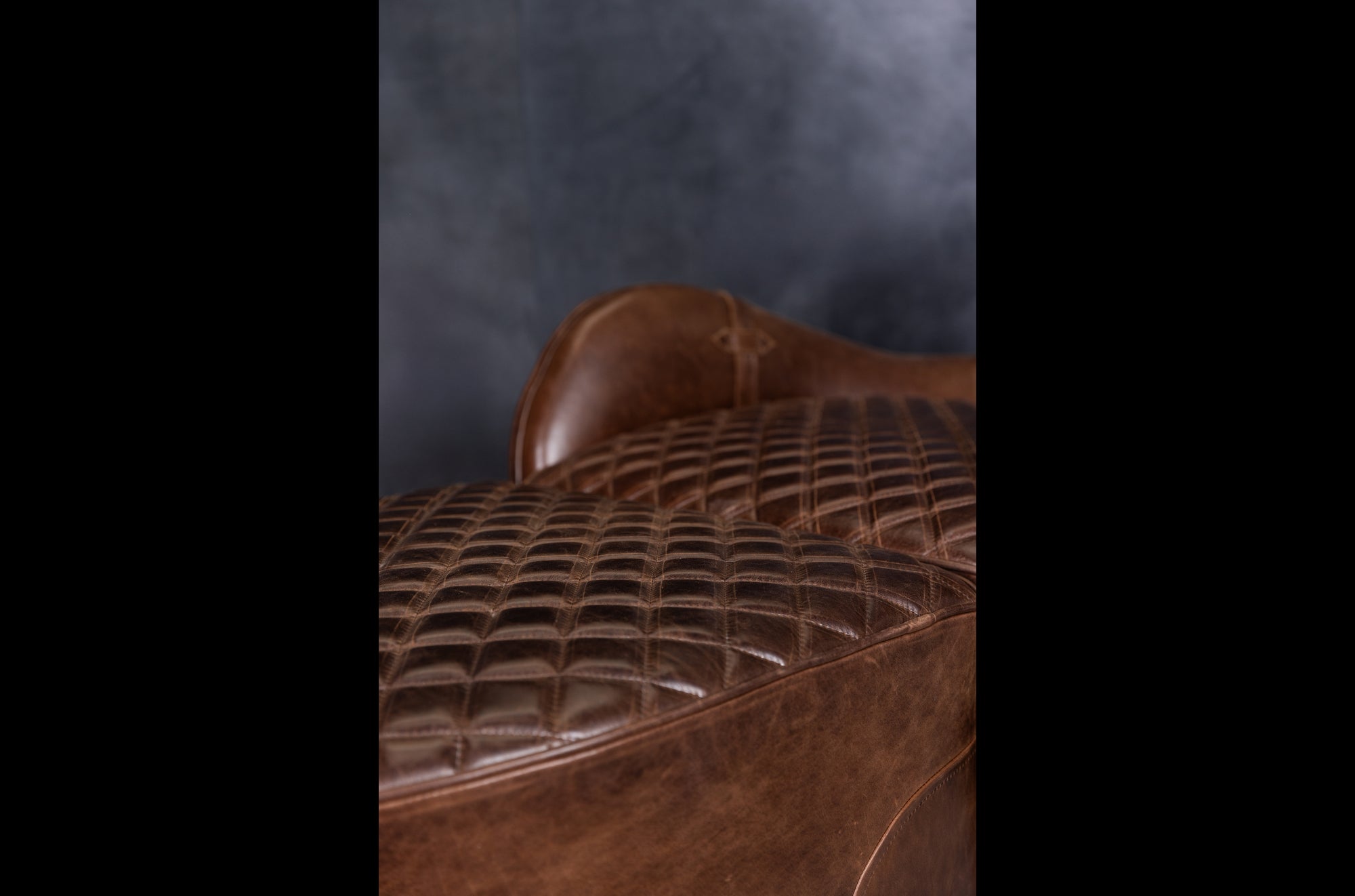 EQUESTRIAN LEATHER CHAIR AND OTTOMAN